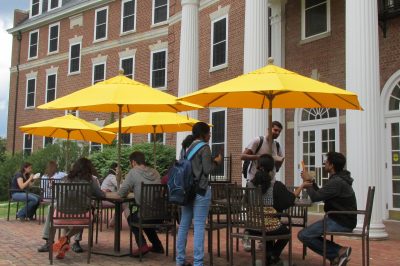 Students gather at the Graduate Life Center patio tables